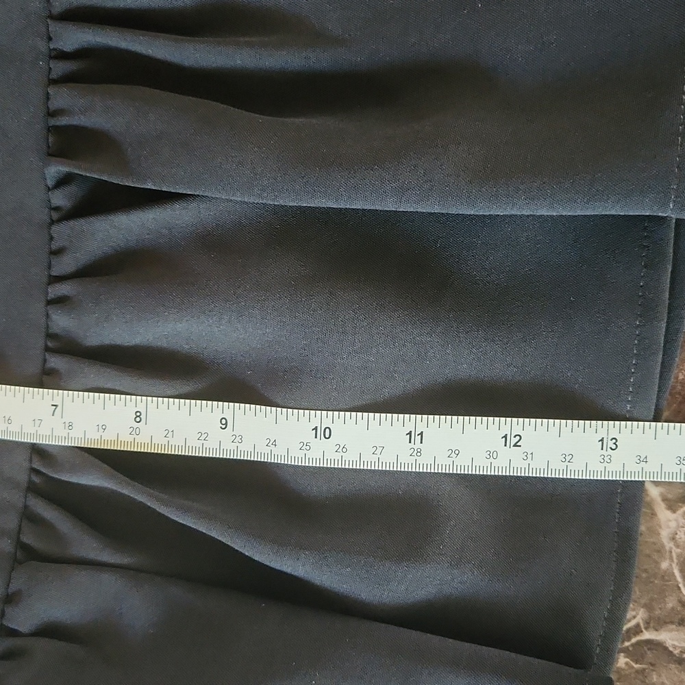 Cute black mini skirt by Impeccable Pig. Zips up the side, great condition! - Picture 9 of 9